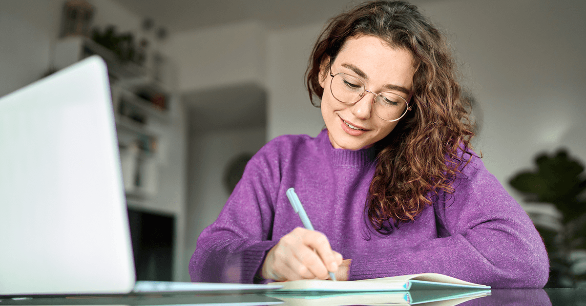 Employee reviewing tuition assistance benefits and course options on a laptop